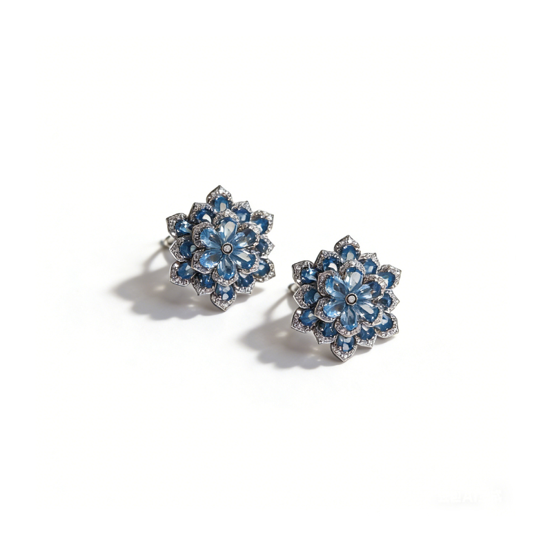 Elegant floral stud earrings featuring vibrant aquamarine gemstones and sparkling diamond accents, set in 925 sterling silver