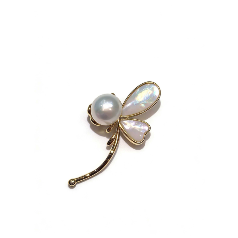 Elegant freshwater pearl dragonfly brooch with iridescent mother-of-pearl wings and gold-toned metal frame, nature-inspired jewelry accessory