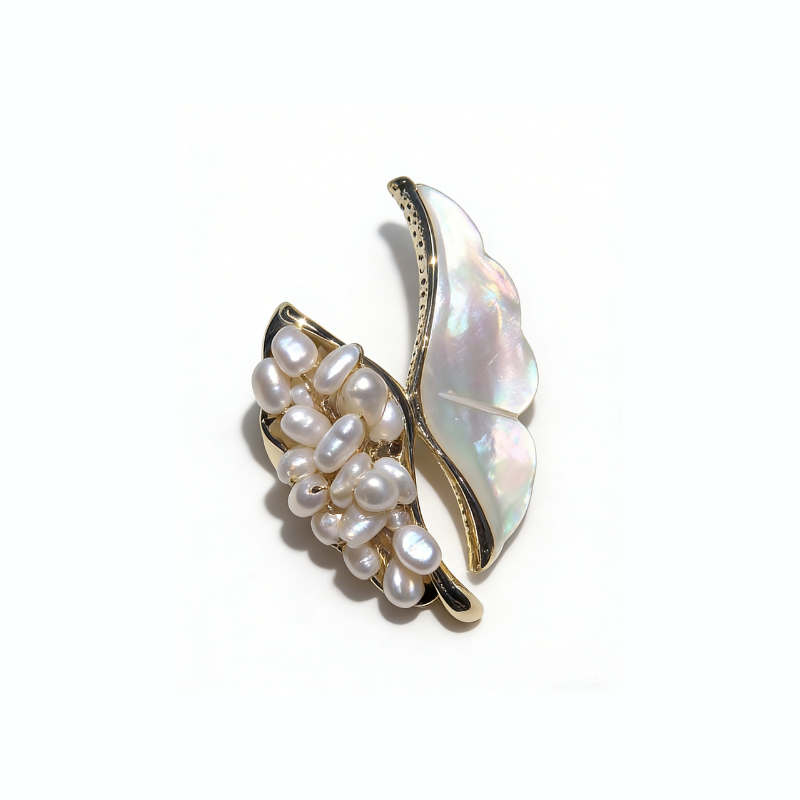 Elegant freshwater non-nucleated pearl butterfly brooch with iridescent mother-of-pearl wings and gold-toned metal frame, luxury jewelry accessory