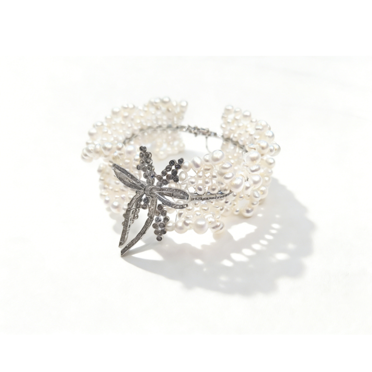 Laurel Bow freshwater pearl cuff bracelet with 925 sterling silver plated CZ bow centerpiece, multi-strand pearl statement bracelet