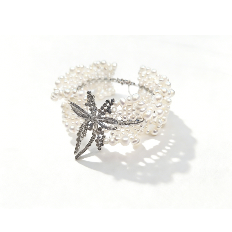 Laurel Bow freshwater pearl cuff bracelet with 925 sterling silver plated CZ bow centerpiece, multi-strand pearl statement bracelet